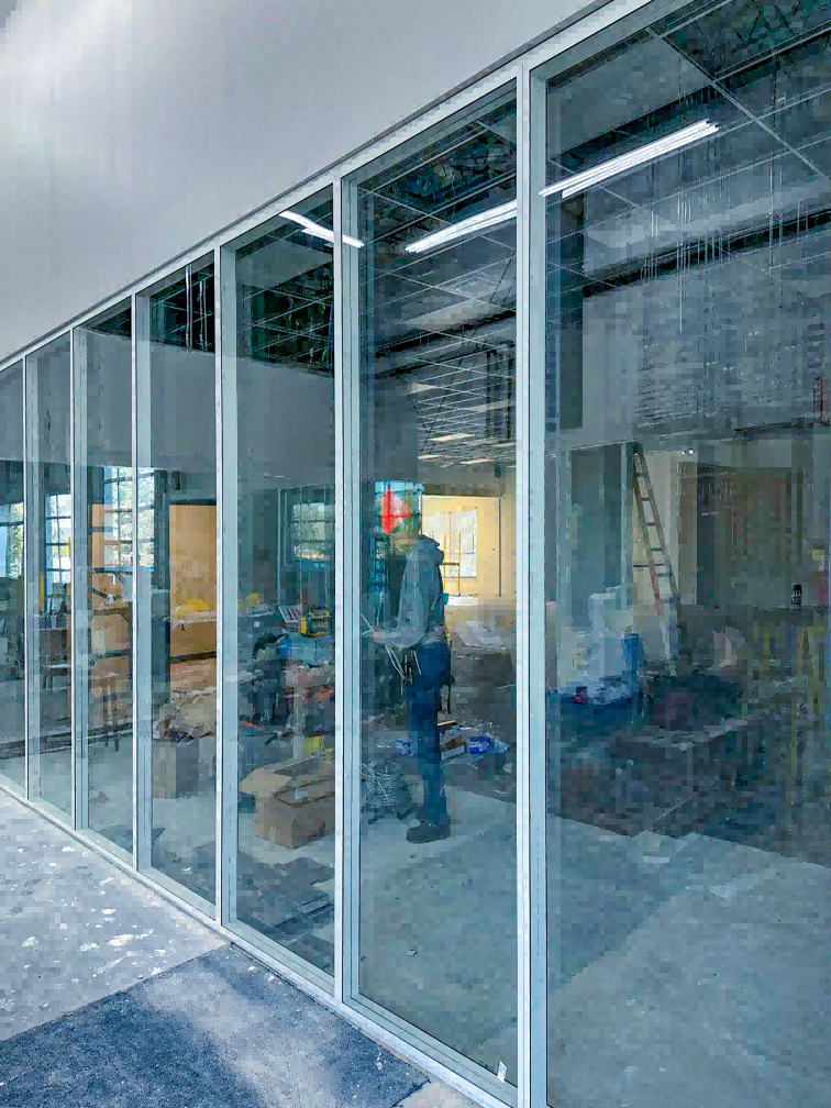 A 2.78m high framed glass wall from our 108 series, installed in a US office to balance structural integrity with maximum transparency and light.